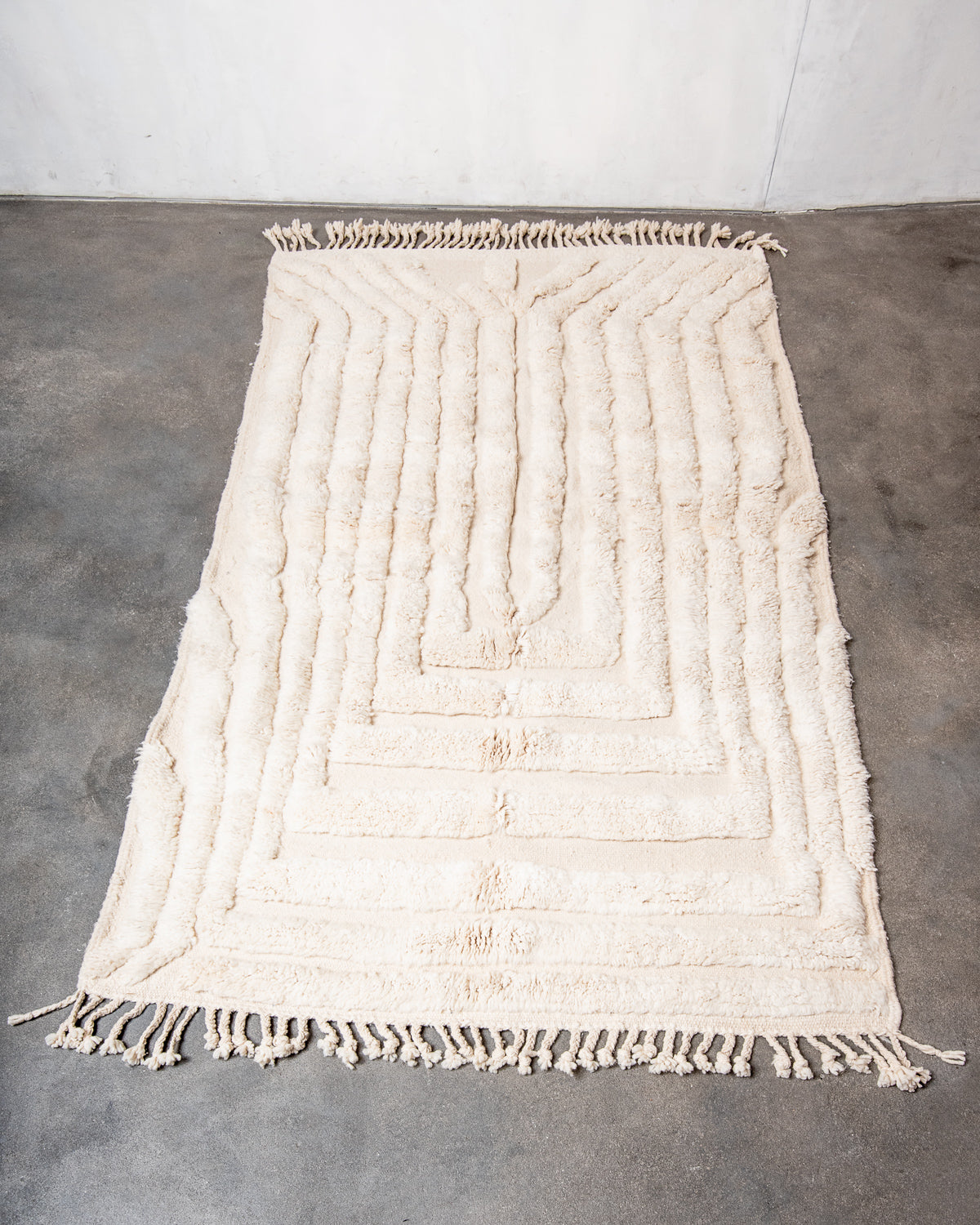 Modern, designer, handcrafted Berber rug from Morocco. Beniourain carpet with minimalist design, natural wool pile and a fluffy texture.